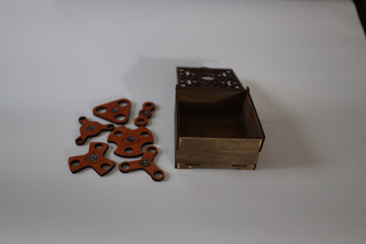 3 mm wooden fidget spinners beside the open box