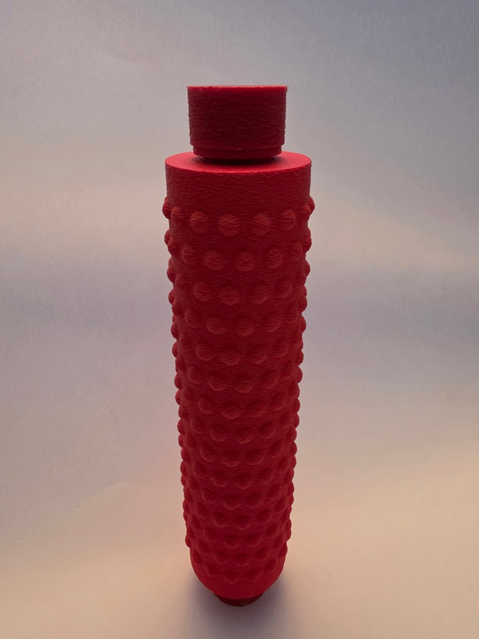 Red massage roller, closer view of the top cap